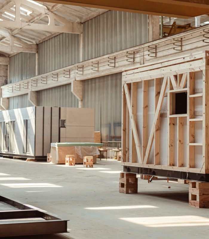 Building under construction with prefabricated containers and cabins